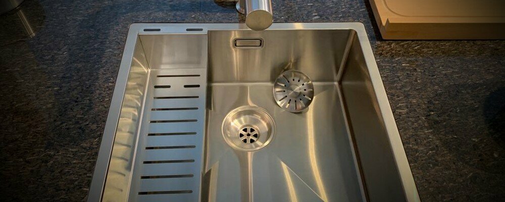 What is a sink strainer and when do you replace it?